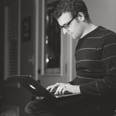 Portrait of Brian Richards using a laptop